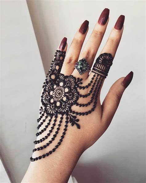 Mehndi is applied all over the world and not only girls apply mehndi on their hands and feet but also men like to apply it on their feet and head. Beautiful Jewellery Mehndi Designs for Back Hand - K4 Fashion