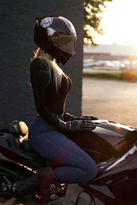 blonde biker girl with a cool agv helmet on a motorcycle girl riding motorcycle girl
