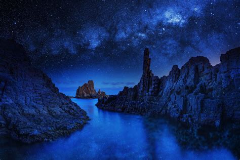 Ocean Rocks On Starry Night