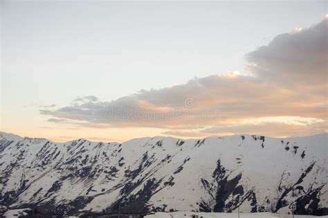 High Mountains With Snowy Peaks Against A Beautiful Pre Dawn Sky With