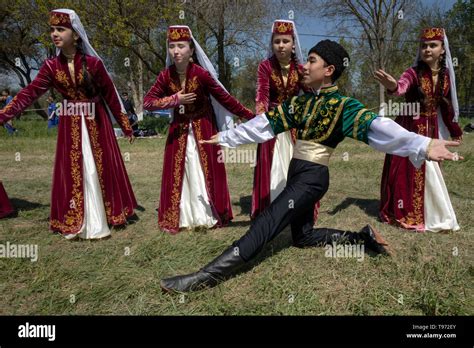 Participants Of The Folklore Group In National Costumes Rehearsing A Dance On During Celebration