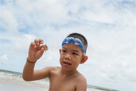 Playful Boy On The Beach With Sea On Background Stock Photo Image Of