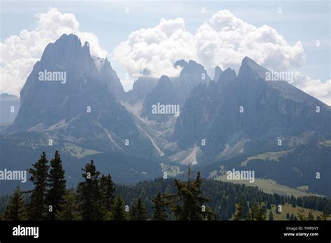 Cloud And Mist Swirling Around The Cliff Faces Of The Langkofel And The