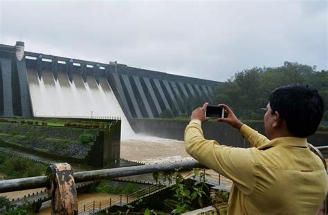 A Man Clicks Picture Of Koyna Dam After Water Was Discharged From It In