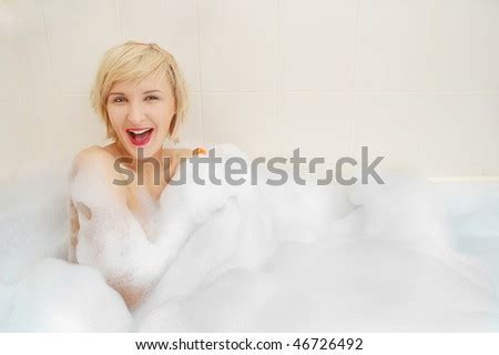 Smiling Blond Woman Lying In Bubble Bath Stock Photo Shutterstock