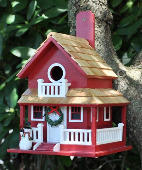 This One Of A Kind Birdhouse Features A Distinctive Wrap Around Porch