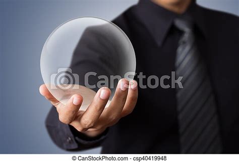 Businessman Hand Holding A Crystal Ball Canstock
