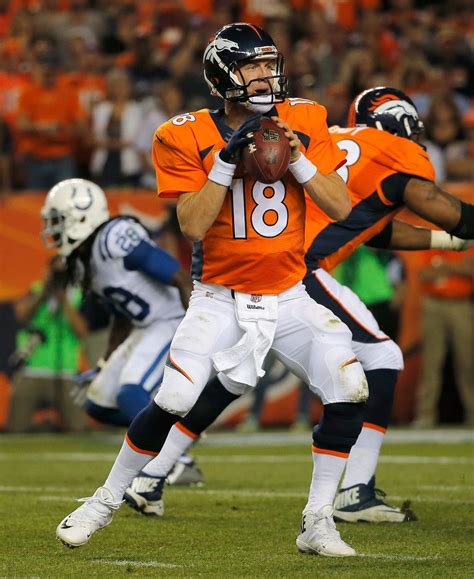 Quarterback Peyton Manning 18 Of The Denver Broncos Looks For A