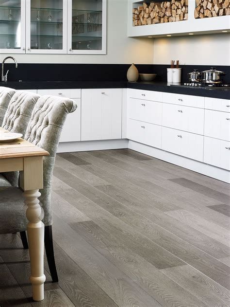 Plank tile 8 wide by 48 long is a big hit, as are 12 x 24 ceramic tiles. How to choose the perfect kitchen flooring | Grey laminate ...