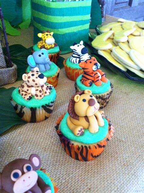 .and grasses and leaves around the bottom. Jungle/safari Baby Shower Cupcakes - CakeCentral.com