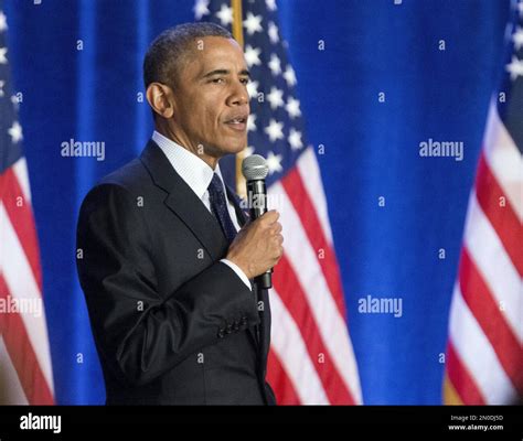 President Barack Obama Picks Up A Microphone To Take Questions From