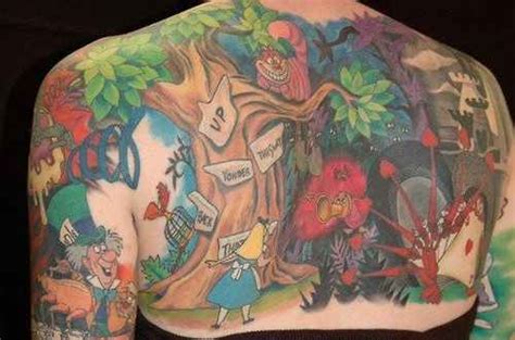 A Full Back Tattoo That Shows Cartoon Scenes From The Walt