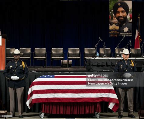 An Honor Guard Stands By The Casket Of Harris County Sheriffs Deputy