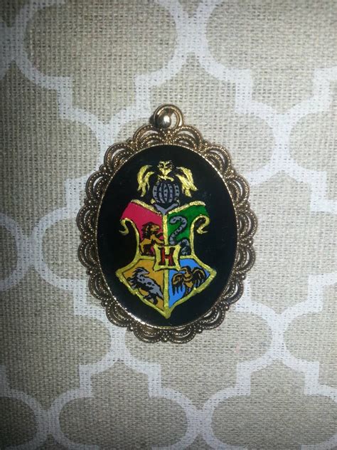 Harry Potter Inspired Hogwarts Emblem Shield Hand by hallieodom