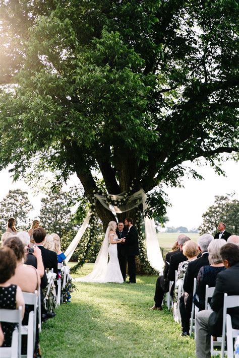 Outdoor Wedding Ceremony Under Tree Floral Design By Charleston Street