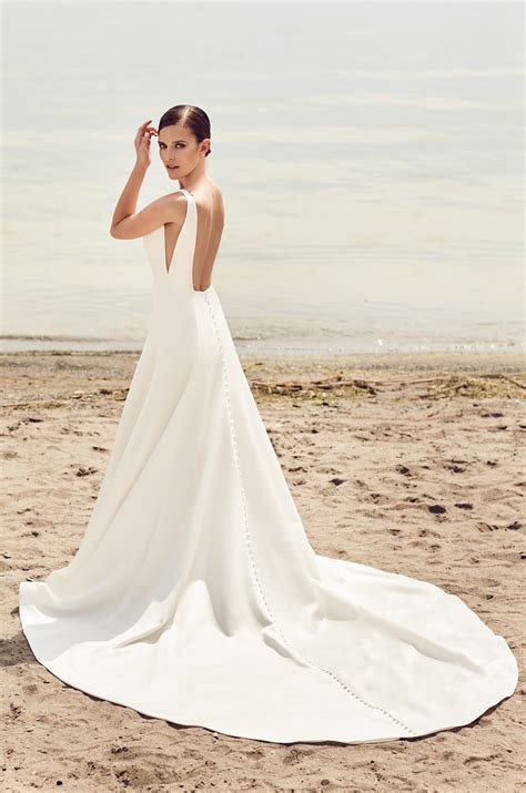 Many brides today choose modest gowns for different reasons. Sleek Modern Wedding Dress - Style #2115 | Mikaella Bridal