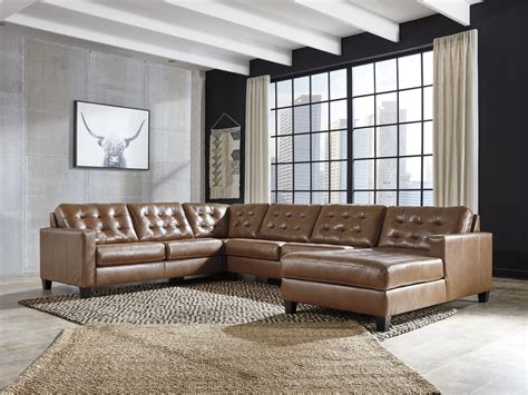 Ashley Baskove Leather Sectional Sofa Features Jumbo Stitching