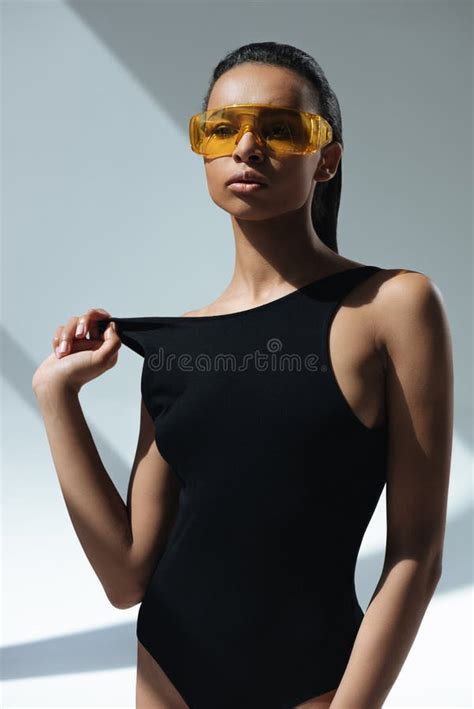 african american stylish model in black swimsuit and protective goggles stock image image of