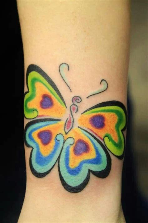 Or perhaps it's flying into the mandala. Butterfly Tattoo by Klayton at Looking Glass Tattoo and ...
