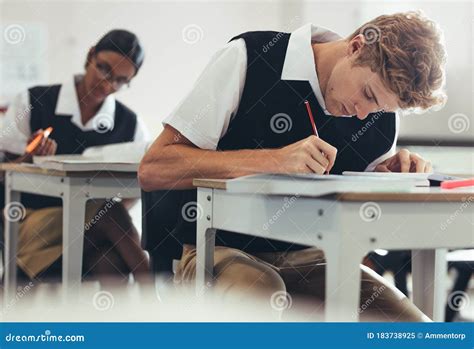 Students Concentrating While Writing During Exam Stock Image Image Of