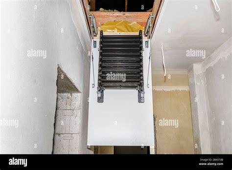 Sliding Metal Stairs To The Attic In The Ceiling An Open Hatch And