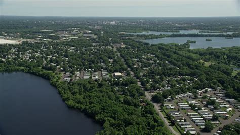 48k Stock Footage Aerial Video Flying Over A Mobile Home Park Near A