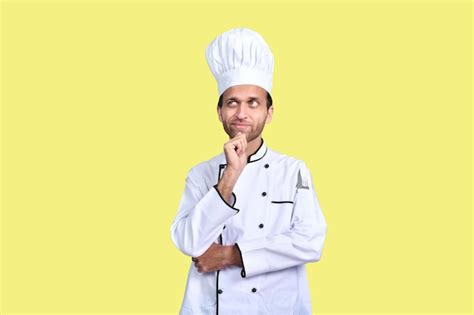 Premium Photo Handsome Chef Cook White Outfit Over Yellow Background Indian Pakistani Model