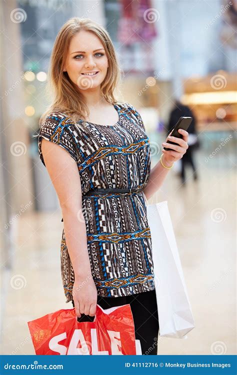 Woman In Shopping Mall Using Mobile Phone Stock Photo Image Of Human