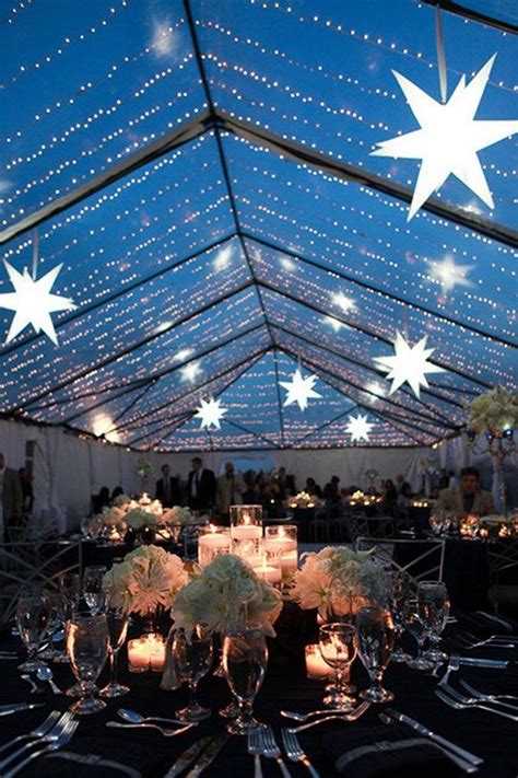 A Large Tent With Tables And Chairs Set Up For A Formal Dinner Under