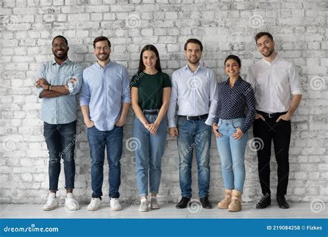Group Portrait Of Diverse Millennial Team Of Employees Stock Photo