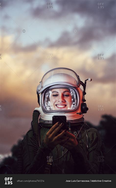 Beautiful Female Astronaut With Mobile Phone Stock Photo Offset
