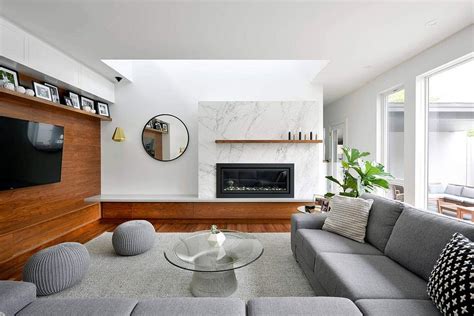 Colouring your walls like living room wall pictures, lighting choices and in addition must be in harmony using the natural light that surrounds the room. Marble, Wood and Modernity: Refined House Addition in Ottawa