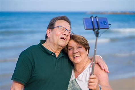 Modern Sweet And Loving Hispanic Mature Couple Taking Selfie Portrait