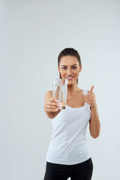 Premium Photo Portrait Of Beautiful Woman Holds Glass Of Water