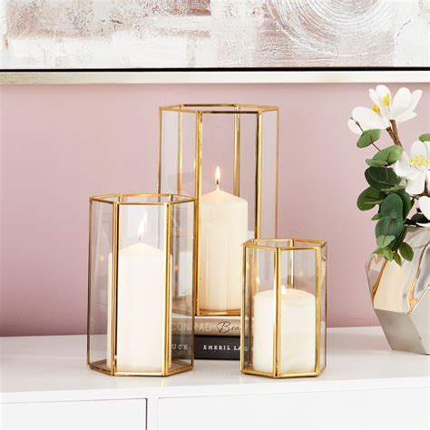 CosmoLiving Large Modern Metallic Gold Metal Glass Candle Holders With Hexagon Silhouettes