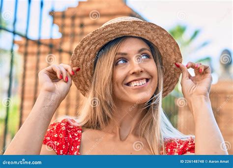 Young Blonde Tourist Woman Wearing Summer Style Walking At The City