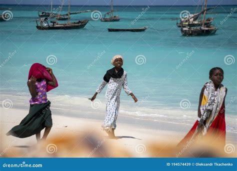Zanzibar Tanzania January 2020 Three Young Local Girls On The Beach With Turquoise Water And