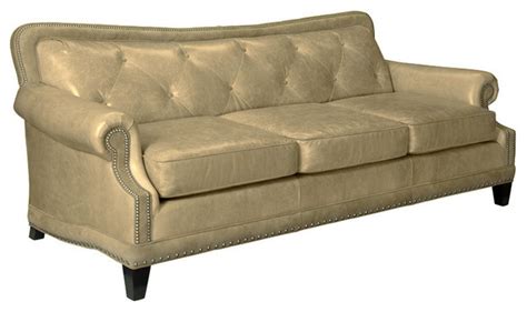 Get the perfect blend of contemporary chic and timeless elegance with this upholstered sofa. Ireland Tufted Leather Sofa, Taupe - Traditional ...