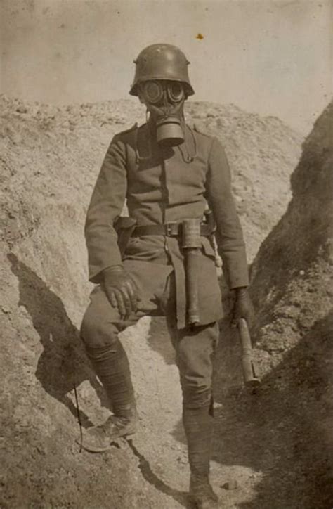 A German Sturmtruppen Soldier Wearing A M1917 Gas Mask And Holding An