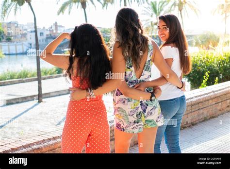Three Latina Friends On A Sunny Day Girl Looking At Camera Young Girl