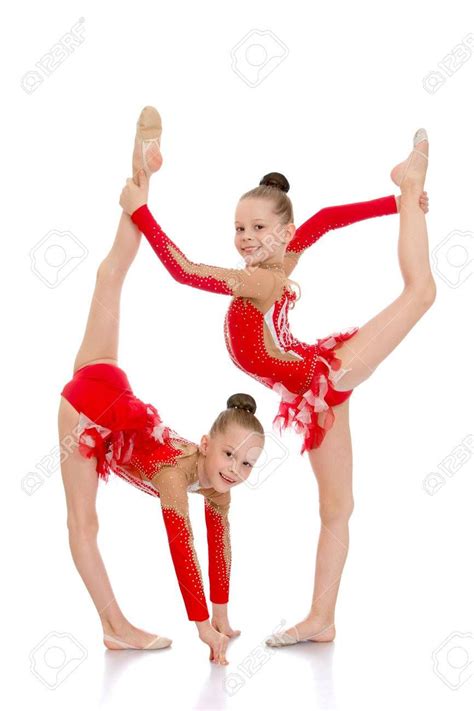 Two Sisters Gymnasts Work Together To Perform Beautiful Gymnastic Exercise Isolated On White