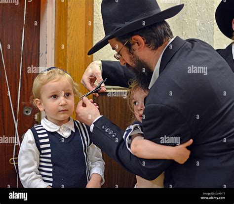 A 3 Year Old Religious Jewish Boy Getting His First Haircut At A Ritual