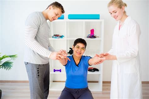 Physiotherapist Helping A Senior Woman Stock Image Image Of Physical Doctor 97727563