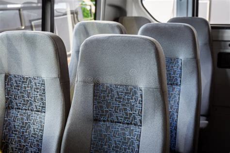 Comfortable City Vehicle Bus Salon With Empty Passenger Seats Stock