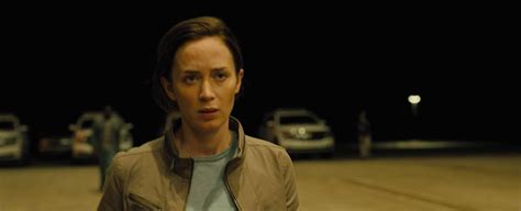 Emily blunt, star of sicario, sitting on a bed with a guy while in a bra, showing cleavage as they snap some pictures with a polaroid camera and kiss. New SICARIO Trailer Starring Emily Blunt & Benicio Del ...