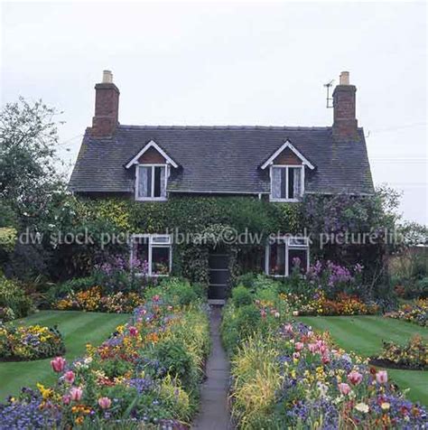 Wattle fencing was first made in england. ENGLISH COTTAGE AND GARDEN SCENE