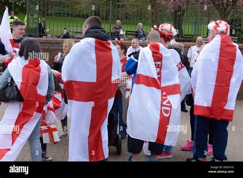 st george s day parade marchers massing wrapped in flags of st george nottingham england
