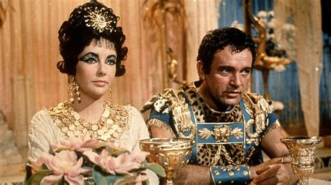 Roman statue of julius caesar and ancient ruins of palatine towers in turin, italy. Elizabeth Taylor as Cleopatra