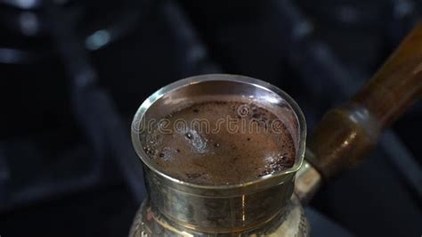 Boiling Turkish Coffee In Copper Cezve On Gas Stove Close Up Stock