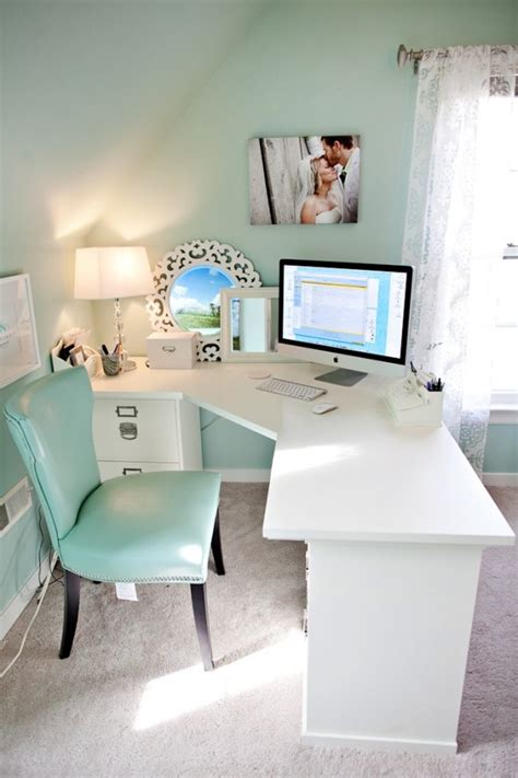 A White Desk With A Computer On Top Of It In A Room That Has Carpeted